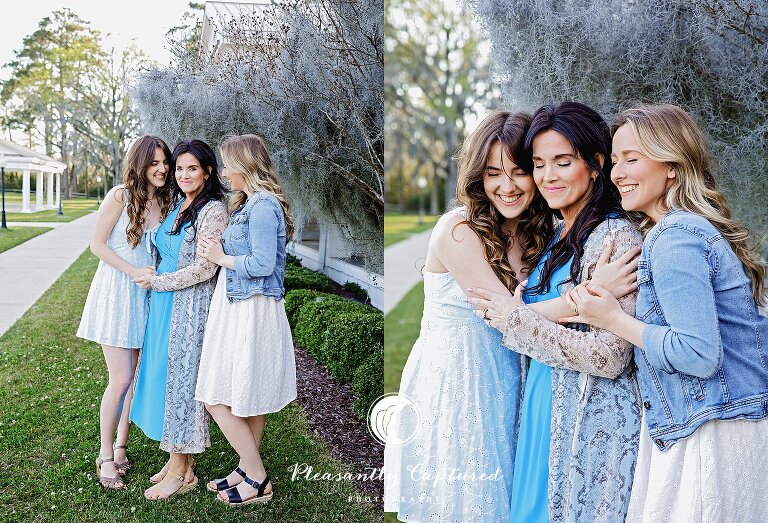 Mother snuggles wither her daughters at outdoor park on camp lejeune nc