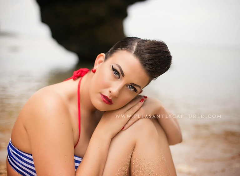 Gorgeous pin-up model on the beach with head resting on hands - Jacksonville NC Photographer