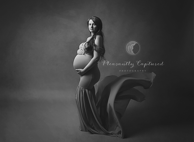Beautiful black and white studio maternity session in flowing gown Pregnancy Photography NC pleasantly captured