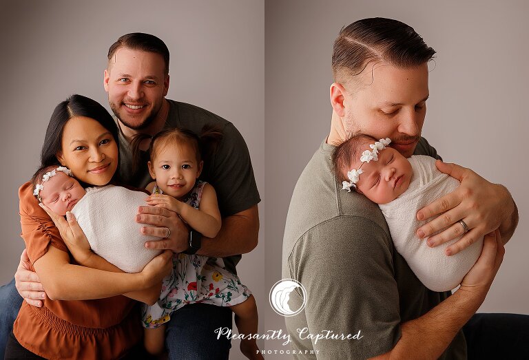New family of 4 and father holding new baby - jacksonville NC photographer