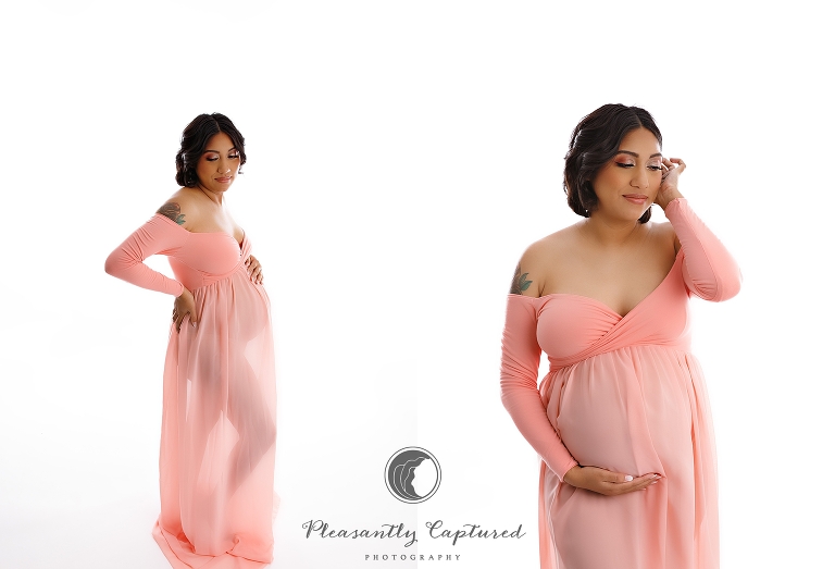 Pregnant mother wearing pink dress at nc maternity photographer studio