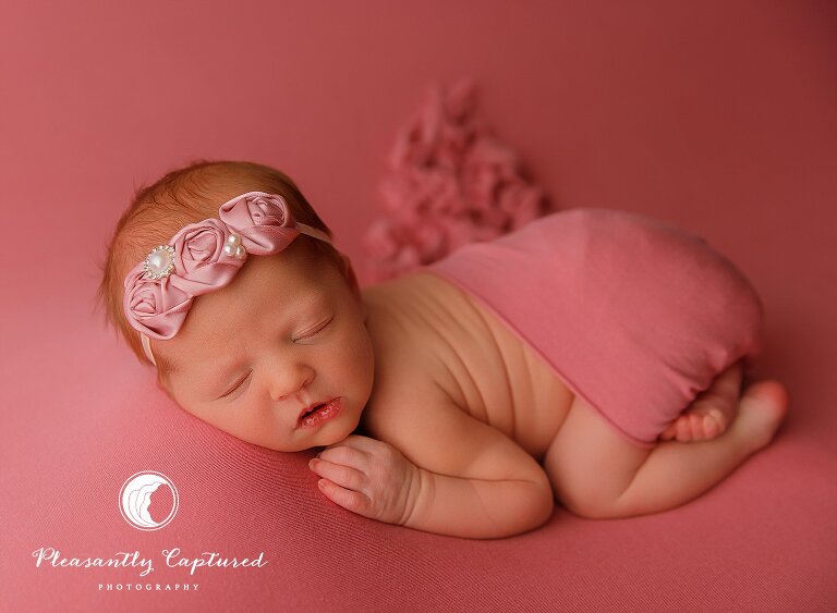 newborn baby girl in pink fabric - Jacksonville Newborn Photography | New Family of 3