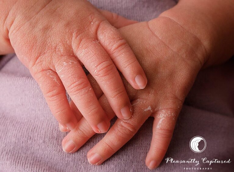 Close up of baby hands on purple fabric - richlands nc Newborn photographer