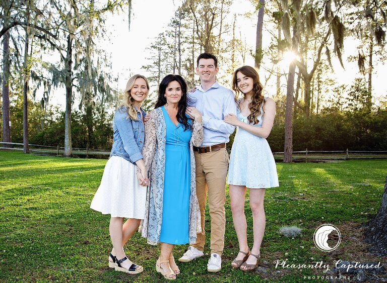 Mother is embraced by her children in trees at Marston Pavilion Sneads Ferry family photographer