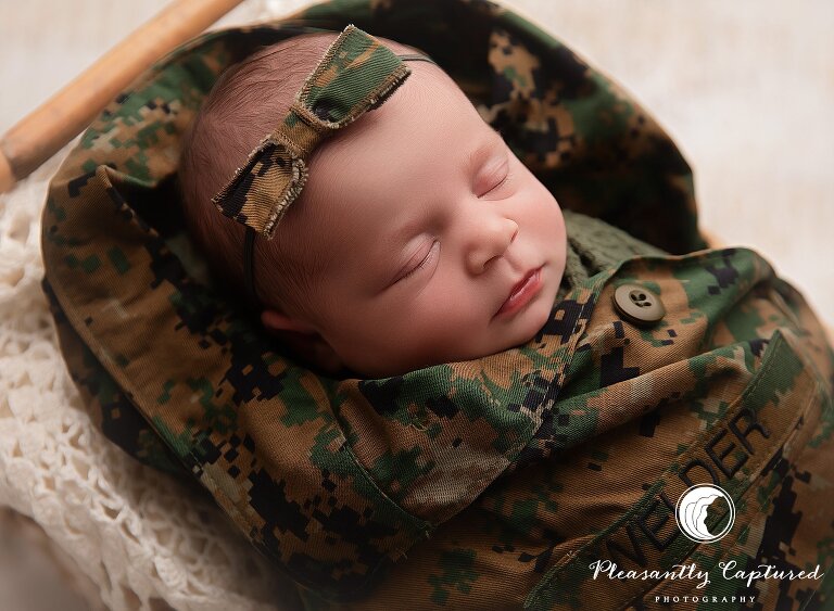 Military-themed newborn photography session honoring Marine family in Jacksonville, North Carolina