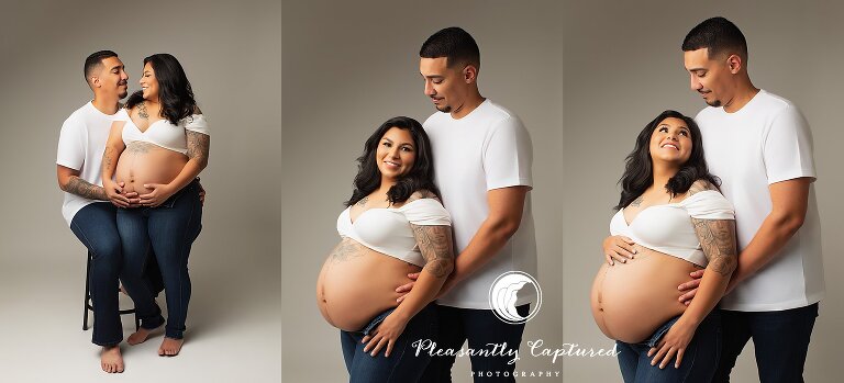 Father and mother cradling pregnant belly expecting a baby - studio maternity photographer Jacksonville nc
