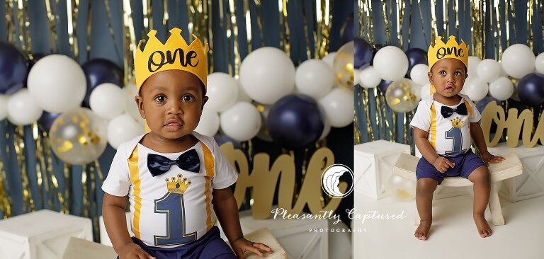 Studio portrait of a baby boy wearing a crown during a first birthday cake smash photography session.
