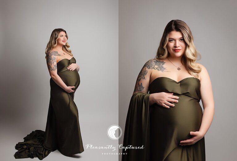 Studio maternity portrait of expecting mother in olive green gown holding her baby bump