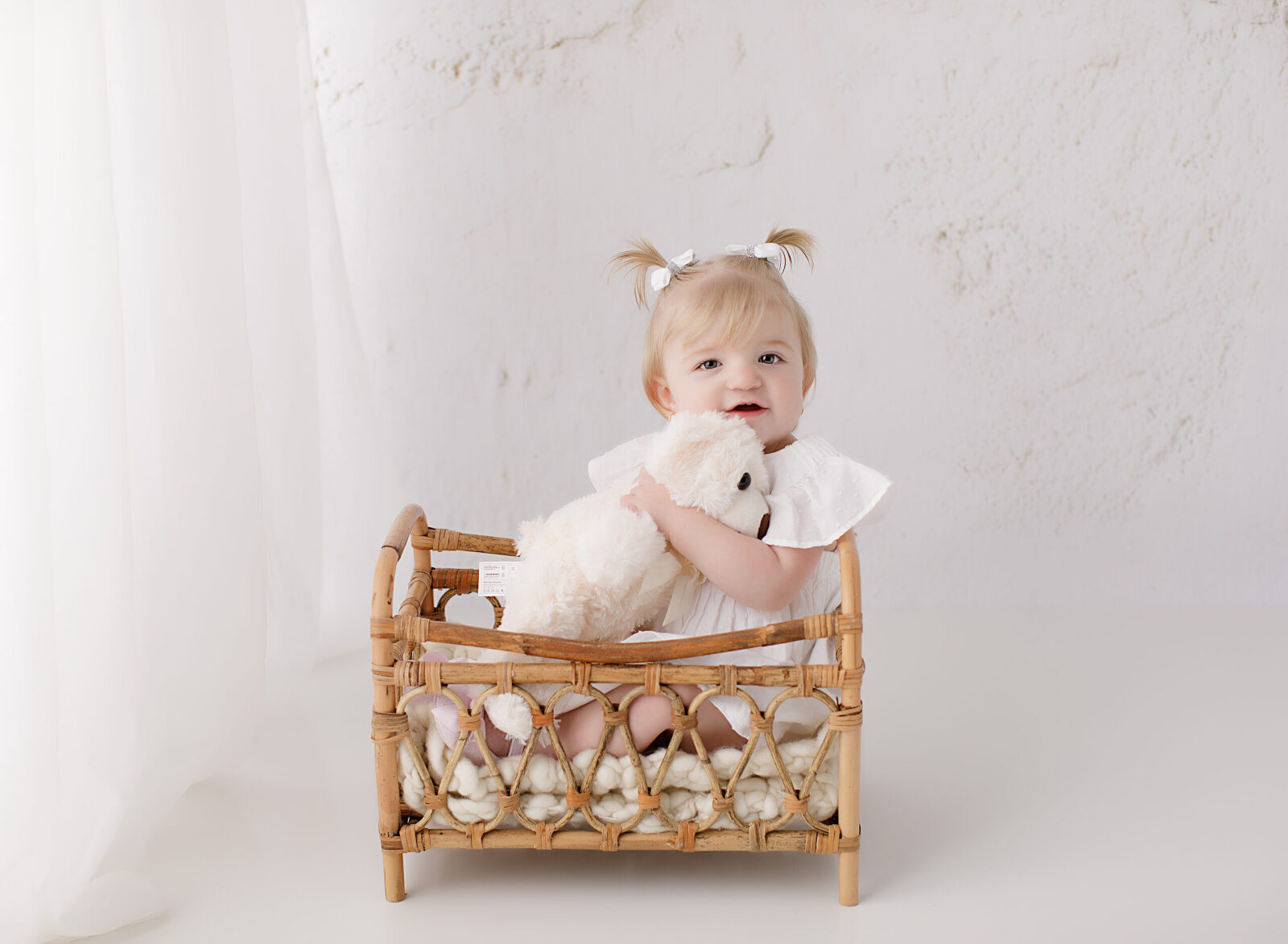 little girl holding bear