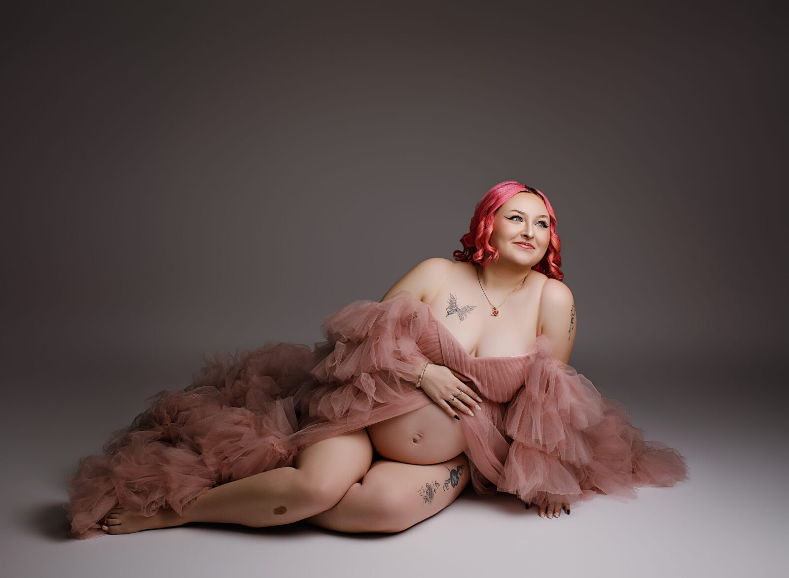 Beautiful pregnant mother to be in pink gown with pink hair - Jacksonville NC Studio Maternity Photographer